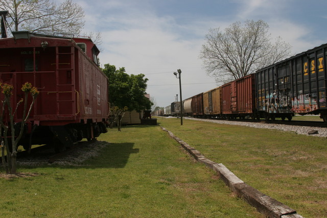 The train rolls through Colbert on a beautiful day.  The caboose on the is always open on July 4th.  