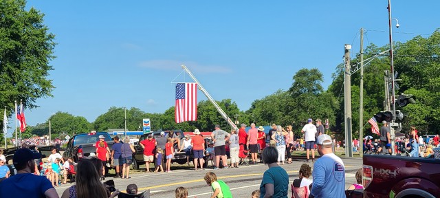 PROUD DISPLAY OF OUR AMERICAN FLAG MADE POSSIBLE BY A LOCAL VOLUNTEER FIRE DEPARTMENT.